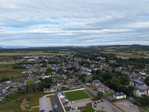 Dornoch is a historic Scottish Highland town, known for its 1224 cathedral, 1509 castle, 1628 royal burgh status, and traditional streets.