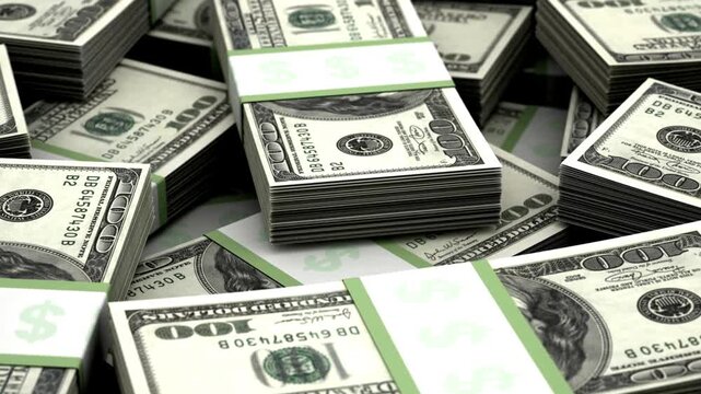 Stacks of American hundred dollar bills are bundled together with paper bands on a dark background.