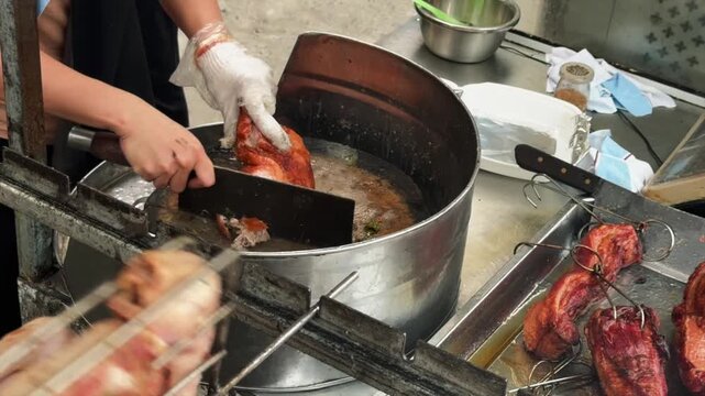 Grilled duck being chopped at a streetfood stall in Ninh Binh, North Vietnam
