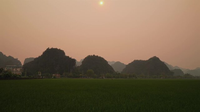 Sunset in Ninh Binh, North Vietnam in the middle of a rice field