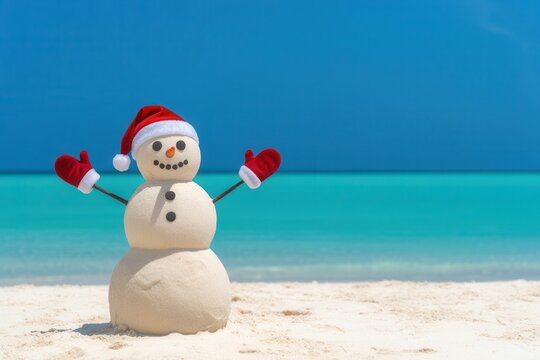 Festive sandman on sunny tropical beach with Santa hat.