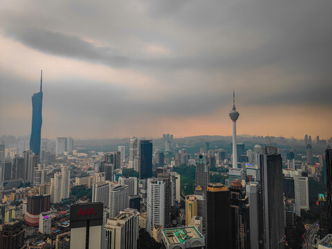 08 02 2026 - Kuala Lumpur, Malaysia. Aerial drone night panorama of Kuala Lumpur, Malaysia, illuminated Petronas Twin Towers and iconic skyscrapers with dramatic lightning in the stormy background