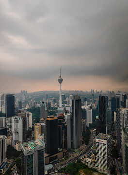 08 02 2026 - Kuala Lumpur, Malaysia. Aerial drone night panorama of Kuala Lumpur, Malaysia, illuminated Petronas Twin Towers and iconic skyscrapers with dramatic lightning in the stormy background
