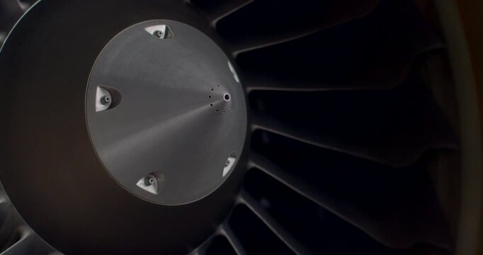Blade under shadows. Intimate perspective highlighting turbine blade with dramatic lighting effects. Detailed closeup capturing intricate design and lighting of turbine blades