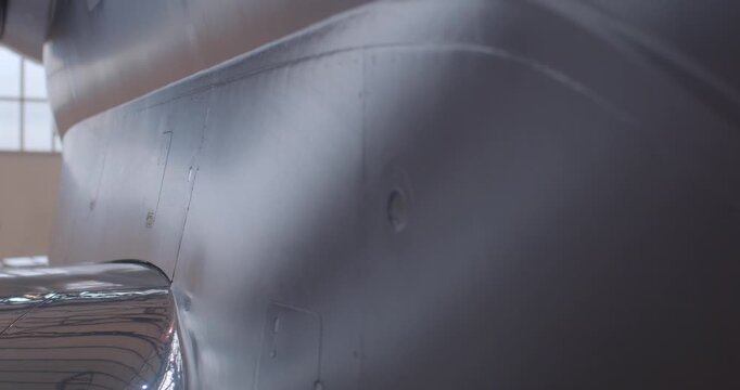 Engine pylons and aerodynamic feature evaluation conducted. Inspection of engine mounting points highlights aerodynamic details and maintenance procedures observed