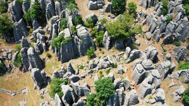 Manavgat Adam Kayalar aerial view showing fantastic conglomerate rocks in Antalya Turkey. Majestic drone shot of unique "Man Rocks" formation surrounded by nature.