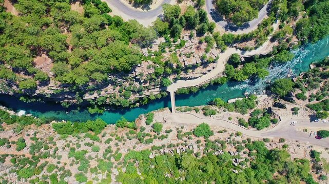 Aerial view of Koprulu Canyon in Manavgat, Antalya, showcasing the dramatic river gorge and lush green forest landscape. Majestic drone shot over Turkey's famous national park.
