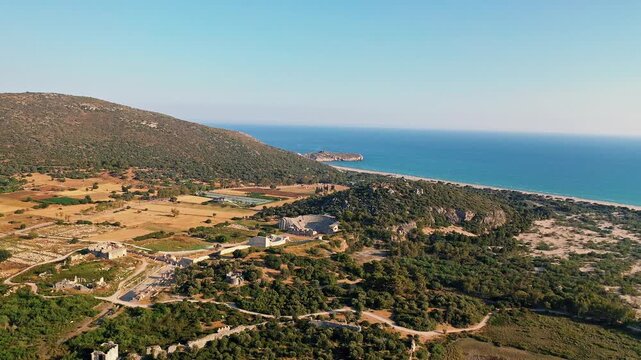 Patara ancient city in Antalya aerial view showcasing historic Lycian ruins and ancient parliament building in Turkey. Majestic drone shot over stone structures.