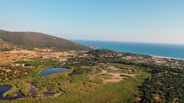 Patara ancient city in Antalya aerial view showcasing historic Lycian ruins and ancient parliament building in Turkey. Majestic drone shot over stone structures.