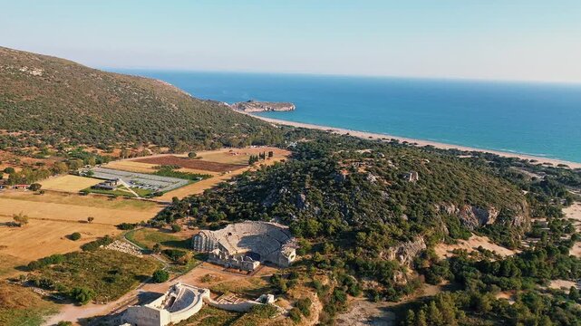 Patara ancient city in Antalya aerial view showcasing historic Lycian ruins and ancient parliament building in Turkey. Majestic drone shot over stone structures.