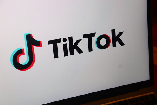 TikTok official short-form video hosting service and social networking platform corporate brand identity. This digital application provides global users with viral media content creation.