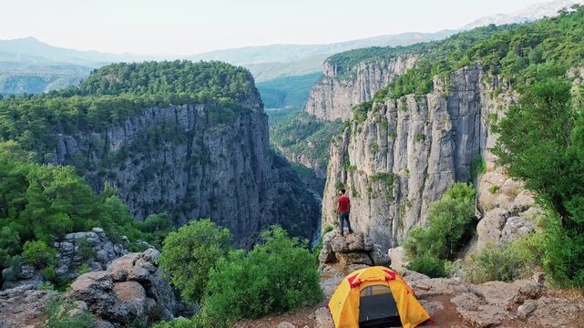 Tazi Canyon Antalya Manavgat camper tent aerial view showcasing a famous tourist destination. Majestic drone shot of a campsite on top of huge rock cliffs.