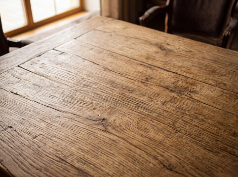 Close-up of rustic wooden table surface with natural grain texture