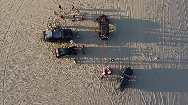 People preparing for a dune buggy tour in huacachina desert