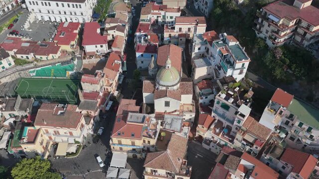 Aerial view of the historic town of Cetara with its church dome, terracotta rooftops, and narrow streets nestled along the Amalfi Coast, Cetara, Amalfi Coast, Campania, Italy.