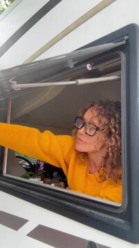 Woman opening the camper van window