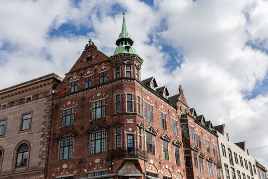 Historic brick building on pedestrian street Stroget in Copenhagen, Denmark
