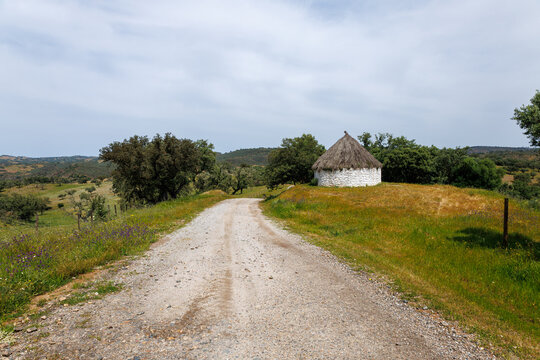 Alentejo countryside road leading to traditional hut
