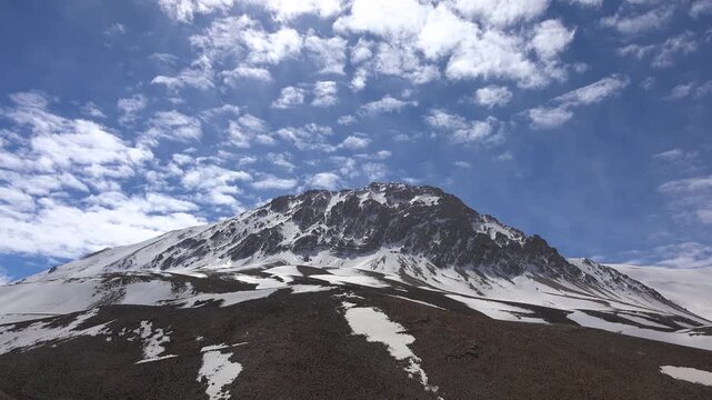 Time lapse of Kizlarsivrisi Mountain in Antalya Turkey as a spring dome peak with patchy snow.