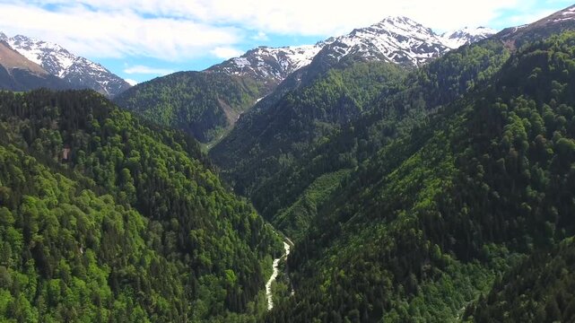 Aerial drone view of fairy tale meadow and mountain houses in forest valley, Rize Turkey.