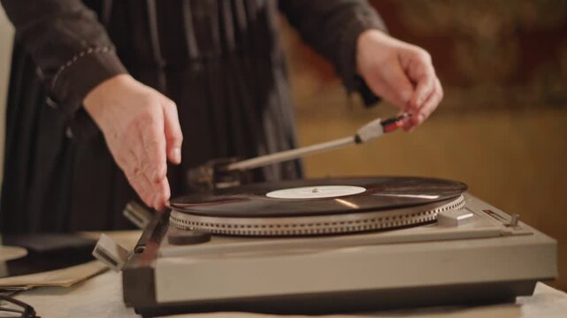 Woman carefully calibrating record player stylus. Lady aligning stylus on turntable with precision expectation. Gentle woman meticulously adjusting tonearm to prepare for melodious first sounds