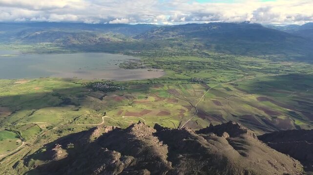 Susehri Sivas valley shows wide mountains, plain lake, and agricultural fields below.