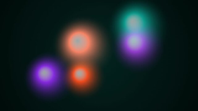 Abstract Glowing Orbs Floating Slowly Against A Dark Background