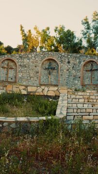 Place of prayer with crucifixes of Christian Jesus in the nature in the mountain