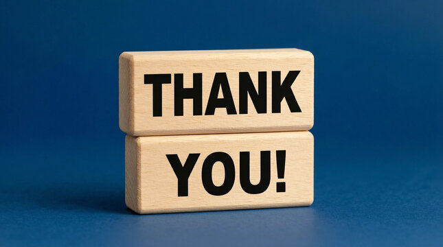 Wooden blocks spelling 'Thank You' on blue background for gratitude messages or customer appreciation