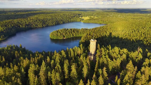 Lookout tower in Finland H&auml;meenlinna Aulanko in nice summer lighting in aerial drone footage. 