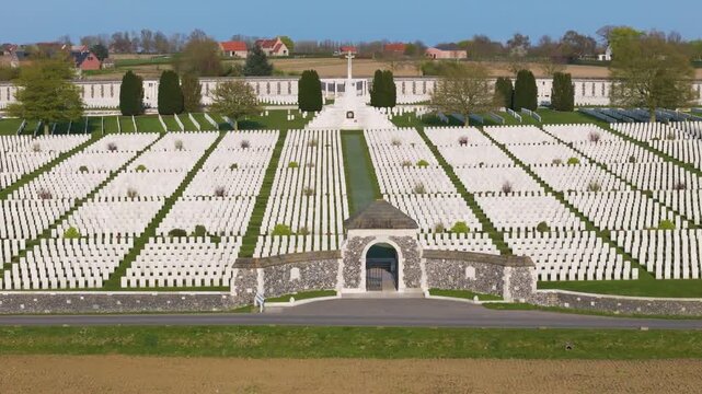 commonwealth war cemetery tyne cot aerial symmetrical view white wwi headstones radiating stone entrance curved memorial wall farmland zonnebeke belgium flanders remembrance pilgrimage 1917 aerial