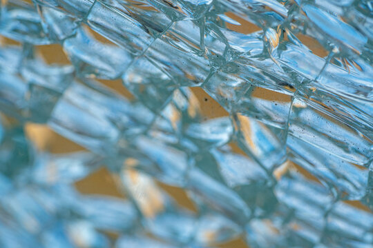 Broken tempered glass window in detail.