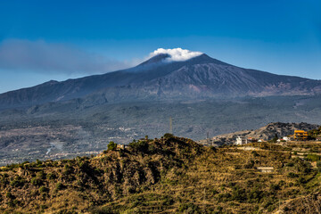 Mount Etna Emitting Smoke Above the Sicilian Landscape from Taormina © Robert
