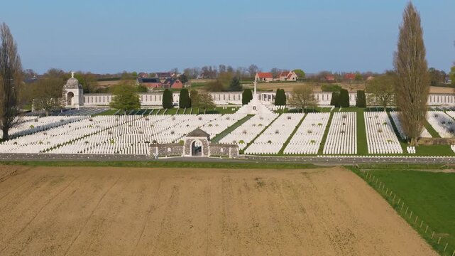 tyne cot war cemetery aerial view pristine white wwi headstones cross of sacrifice domed memorial pavilions farmland zonnebeke belgium flanders remembrance armistice passchendaele pilgrimage 1917