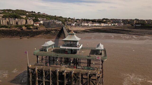 Aerial drone footage of Clevedon Pier and coastline at low tide, Somerset, England