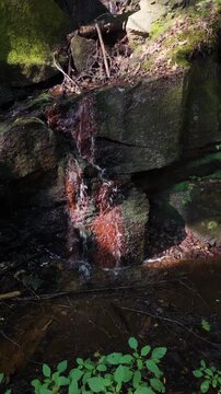 9 x 16 Vertical close up of water running down a ledge face 