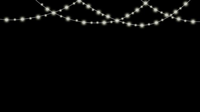 Twinkling golden fairy lights string isolated on black background for festive celebration design elements with glowing warm illumination in looping motion and soft ambient effect.