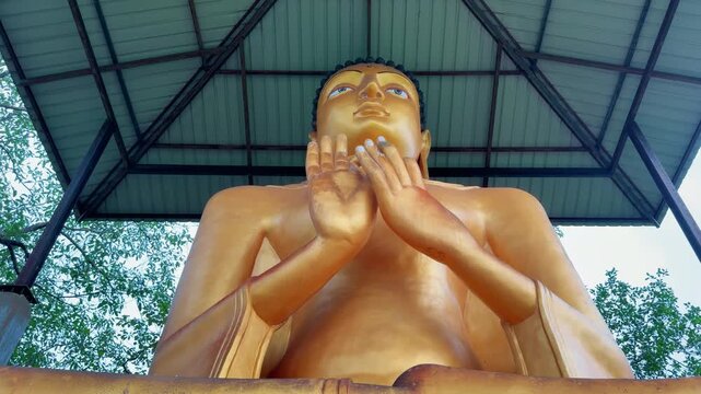 Golden Buddha with Dharmachakra Mudra at Buddhist Temple