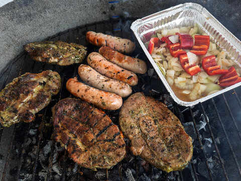 Grilled Meats and Vegetables on an Outdoor BBQ