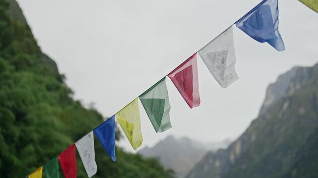 Prayer Flags in Moody Green Mountains in Nature in Nepal in the Himalayas