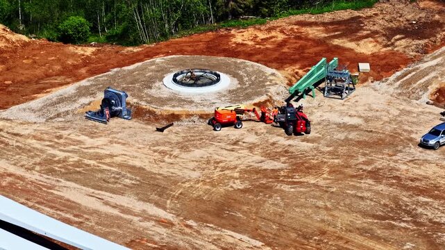 High-angle view of the construction of a concrete base for a wind turbine power generator