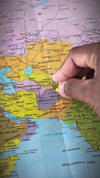 Map of Afghanistan, in South and Central Asia. The country is bordered by Pakistan to the east and south, Iran to the west, Turkmenistan and Uzbekistan to the north