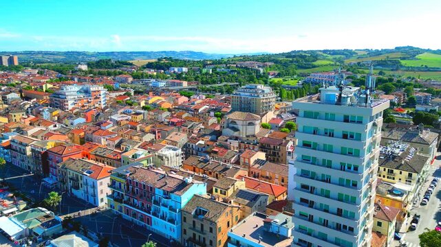 PORTO RECANATI, ITALY - JULY 30, 2025: Aerial truck left shot of Via Lepanto. The Lungomare of Porto Recanati is a pedestrian-only stretch of the Adriatic coast featuring classic Italian seaside charm