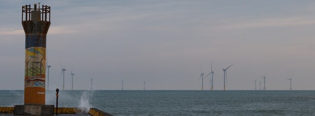 Lighthouse and wind turbine at Longfeng Fishing Harbor © 鴻偉 蔡