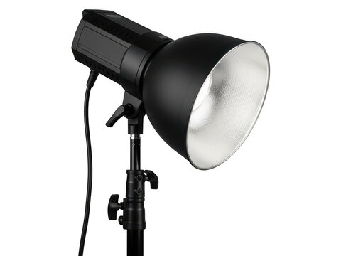 Professional black studio flash light with reflector on a tripod stand isolated on transparent background