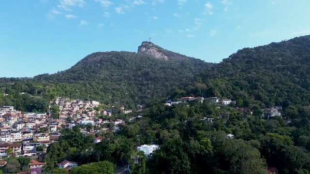 Drone aerial view of hillside favela and Christ the Redeemer in Rio de Janeiro, Brazil