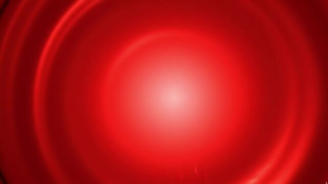 Abstract background with concentric circular ripples in shades of deep red and bright orange