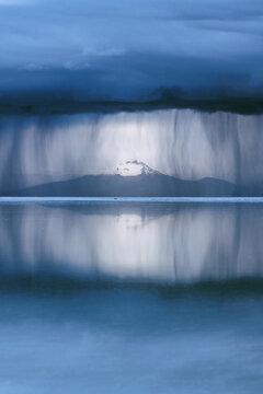 Storm clouds and rain over the Salar de Uyuni, Bolivia