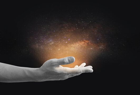 Stars and milky way on human hand. Imagination, ideas and science technology background