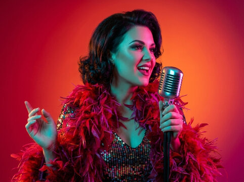 Glamorous Singer Performing with Vintage Microphone